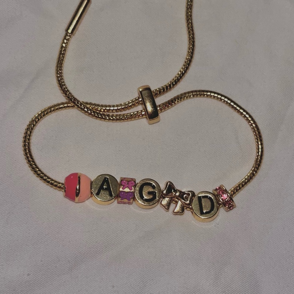 Gold “Alpha Gamma Delta” Sorority Charm Bracelet with Pink and Bow Accents